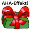 Geschenk rote Schleife AHA-Effekt