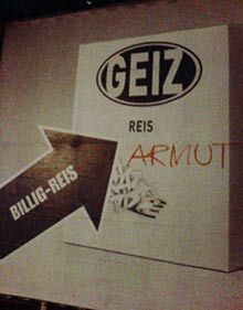 armut in wien, graffiti auf einem werbeplakat